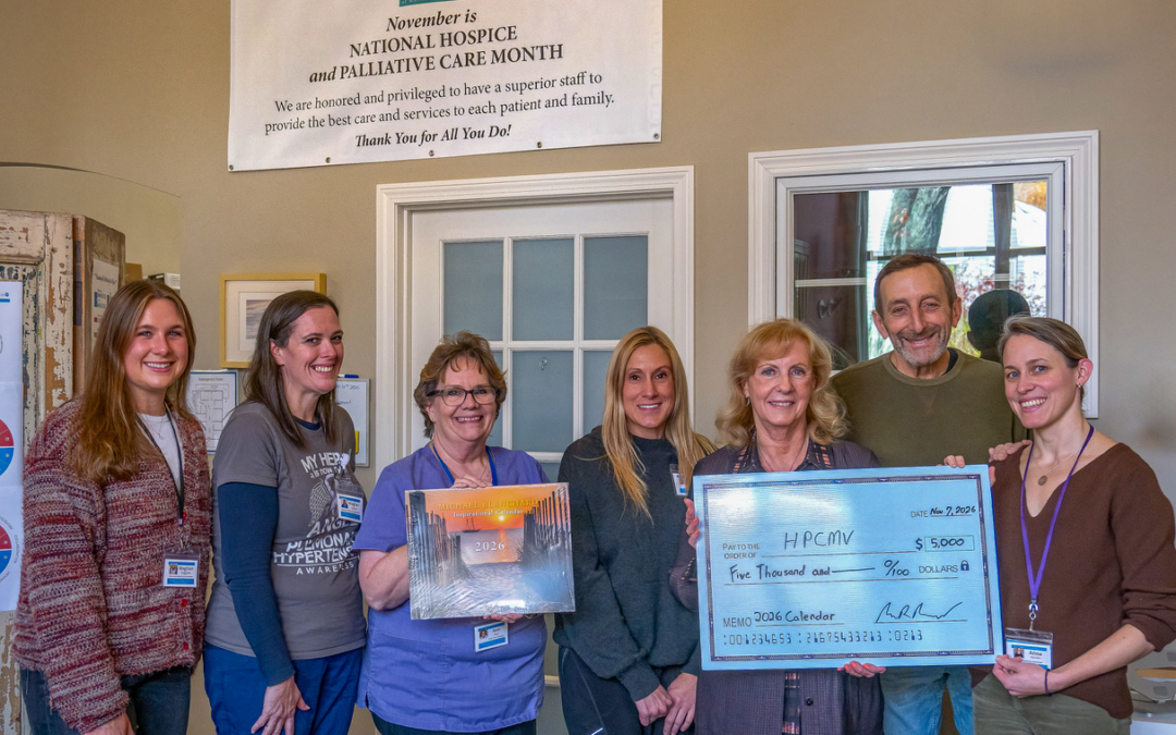 Michael Blanchard presenting $5000 check to HPCMV staff