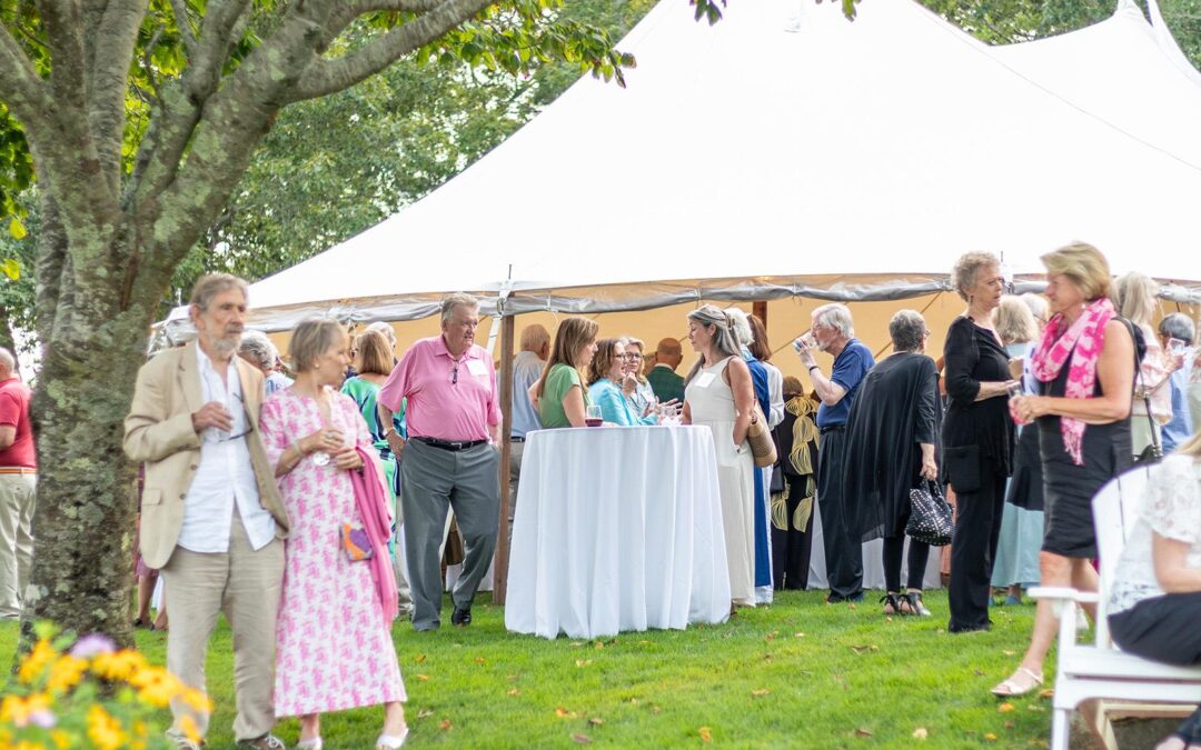 summer soiree guests at farm neck golf club under the event tent